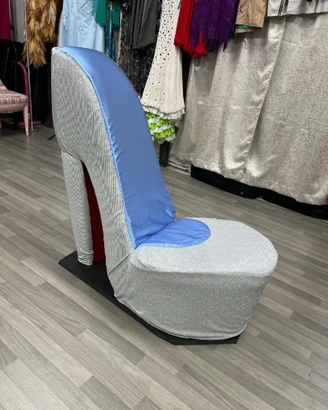 A silver sequined high-heel shoe built at furniture scale