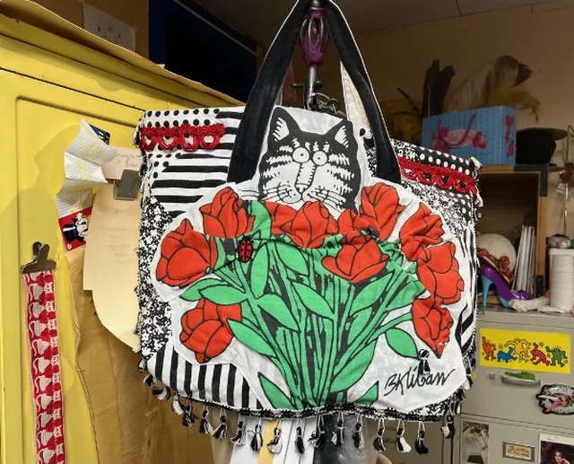 Richly worked patchwork tote with tassels and embroidery