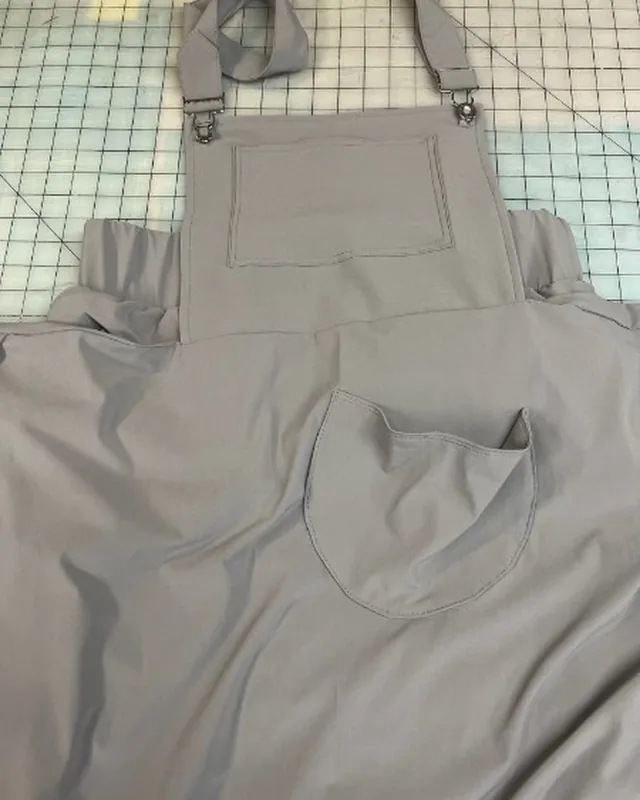 Pocket detail on gray garment